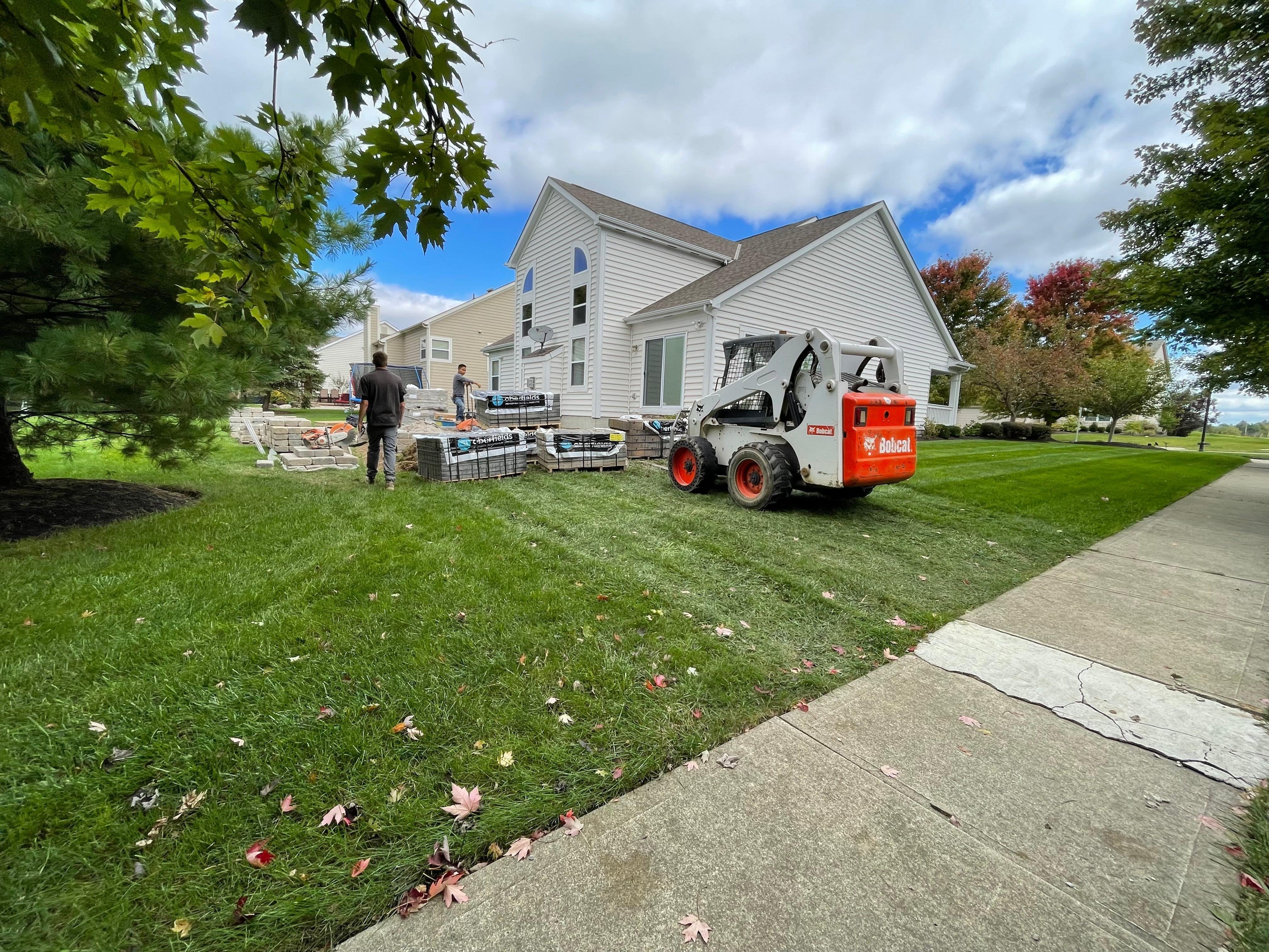 a forklift doing work at a house