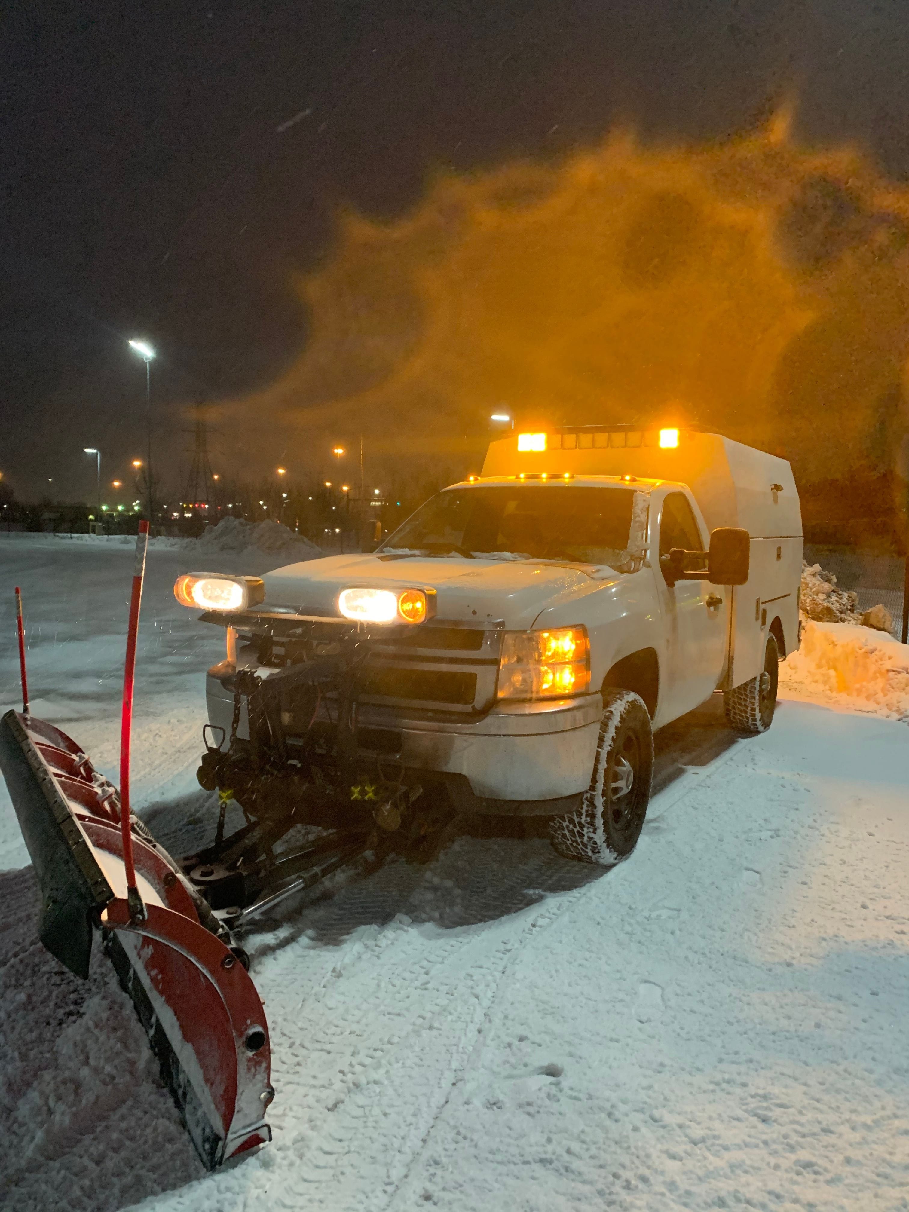 a snow plow plowing snow